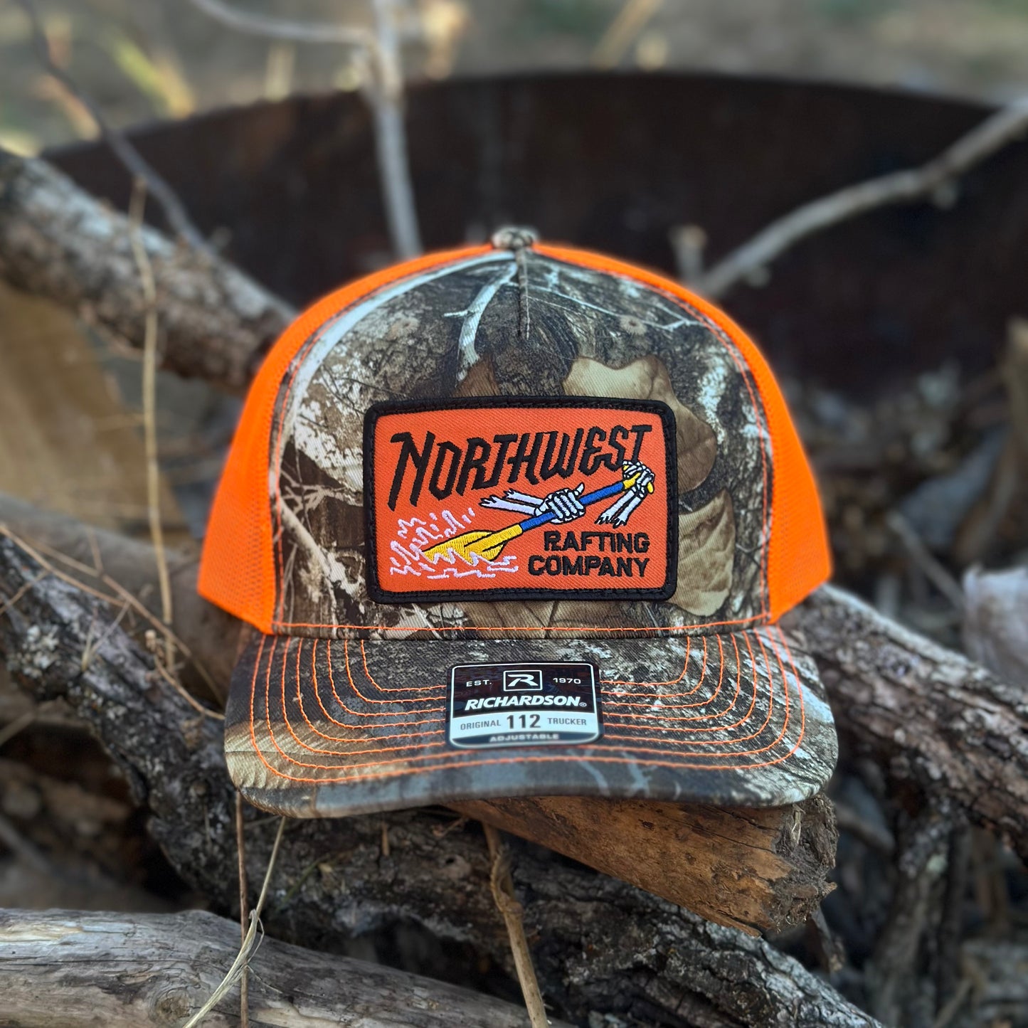 Northwest Rafting Company (NWRC) Work Hat in the Realtree Edge/Neon Orange (Green/Orange) color